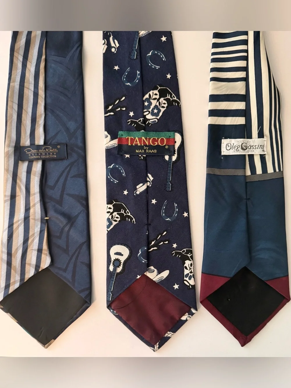 Three neckties. Oscar de la Renta, Oleg Cassini, Tango vintage ties.